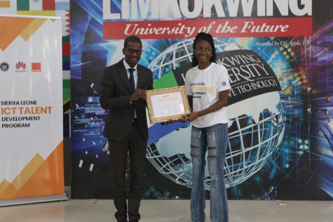 Orange Sierra Leone CEO - Handing over certificate to a graduate during the graduation ceremony at Limkokwing University.